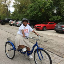 Ekta riding her bike.